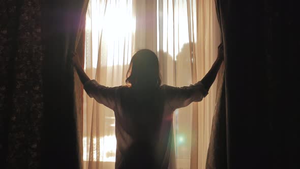 Lovely Girl is Awake and Standing Before Window