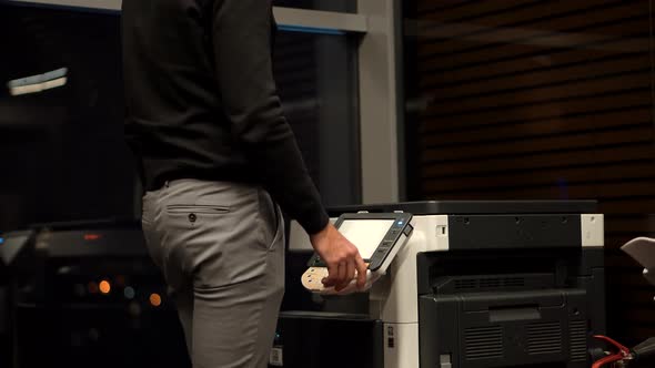 Businessman Working In Office And Preparing Documents For Signature. Man Using Printer Or Scanner.