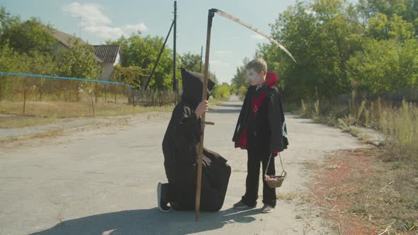 Scary Angel of Death Talking with Boy on Halloween