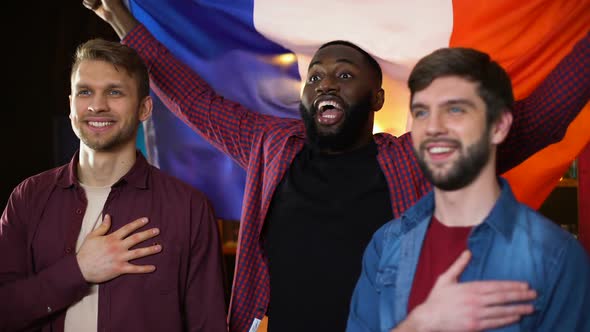 Emotional French Football Fans Cheering for Team, Singing Anthem and Waving Flag