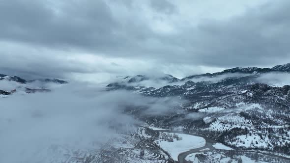 Clouds High in the Winter Mountains Aerial View 4 K