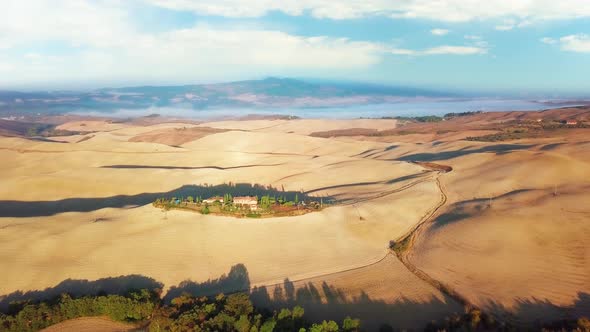 Aerial Flyover the Beautiful Sunset Landscape in Tuscany Italy