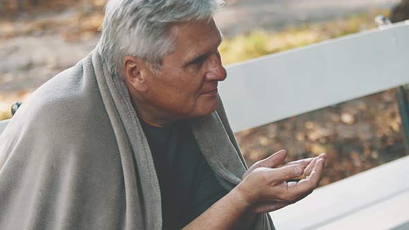 Elderly Homeless Man Begging for Money