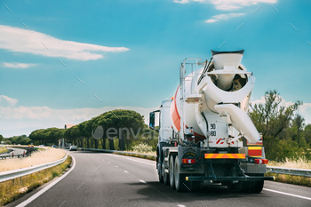 Unit In Motion On Country Road, Freeway. Freeway Motorway Highway. Business Drive Transportation And Development Concept. Concrete Truck Mixer