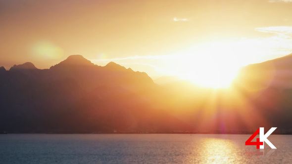 Sunset Behind Silhouetted Mountains