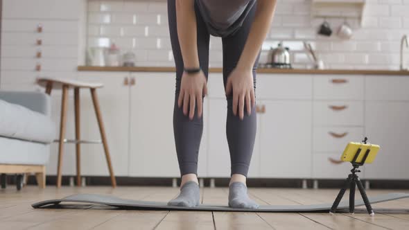 Young Woman Starts her Online Fitness Training