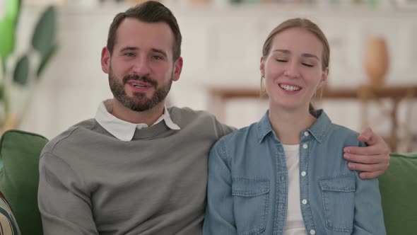 Cheerful Couple Talking on Video Call at Home