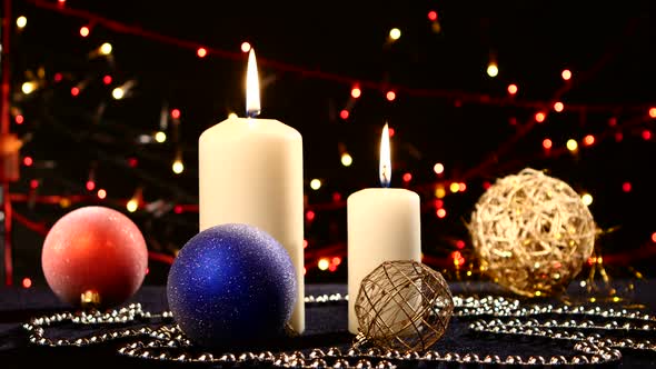 Two Big White Candles with Balls for Christmas on Black, Bokeh, Light, Garland