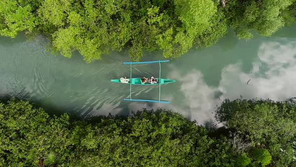 Aerial view of traditional fishing boat in Bojo River, Aloguinsan, Philippines.