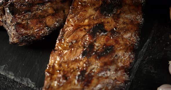 Grilled Ribs Ready on a Stone Board. 