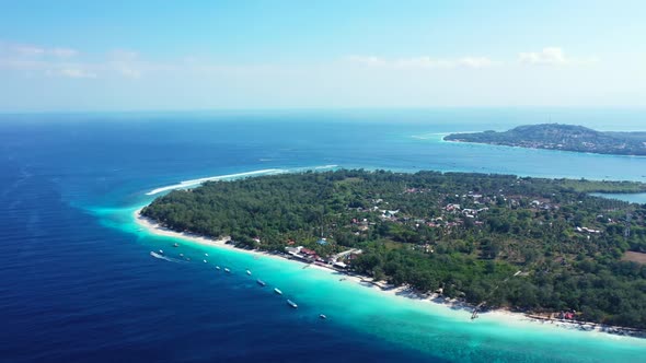 Aerial scenery of tropical resort beach trip by blue ocean with white sandy background of a dayout n