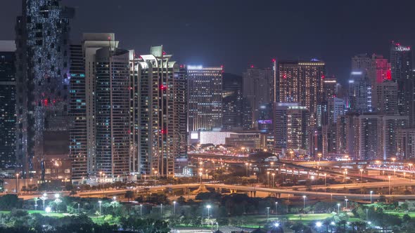Jumeirah Lake Towers Skyscrapers and Golf Course Night Timelapse Dubai United Arab Emirates