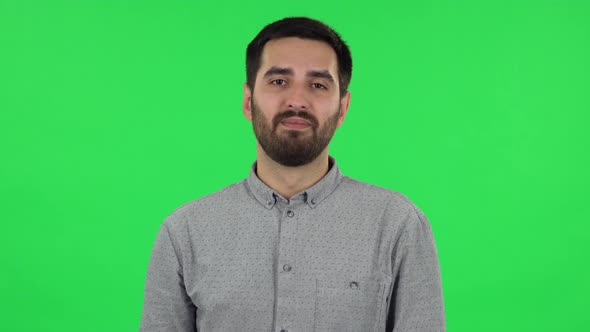 Portrait of Brunette Guy in Anticipation of Worries, Then Smiling and Proud of Himself. Green Screen