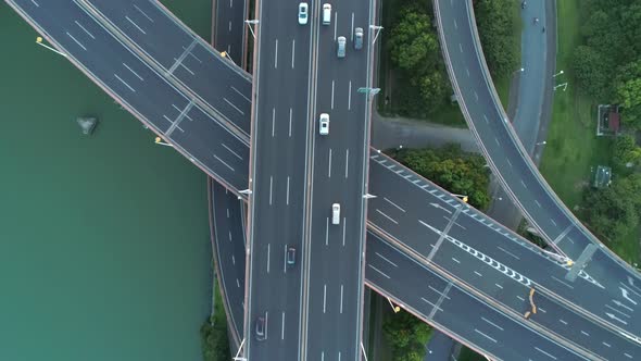 Aerial Drone View of Highway Multi-level Junction Road with Moving Car at Sunset, Active Movement 