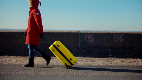 Female Leaves After Family Quarrel. Tourist Travelling Mood. Walking With Yellow Travel Bag