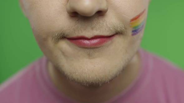 Bearded Man with Painted Lips Smiling on the Camera. LGBT Community. Transsexual