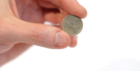 Male Hand Holding A British Pound