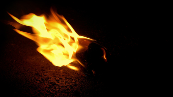 Flaming Debris On Ground Closeup