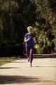 young female runner training for marathon - PhotoDune Item for Sale