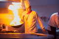 Chef doing flambe on food - PhotoDune Item for Sale