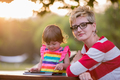 mom and her little daughter using tablet computer - PhotoDune Item for Sale
