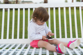 little girl playing with mobile phone - PhotoDune Item for Sale