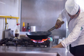 chef preparing food, frying in wok pan - PhotoDune Item for Sale