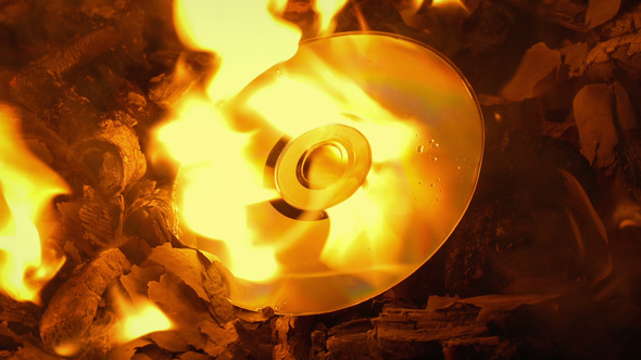 Disc Burns Up In Fire - Destroying Evidence Concept