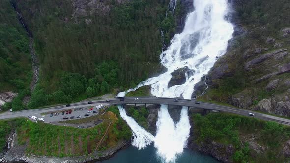 Langfossen waterfalls in Norway, aerial footage on cloudy day