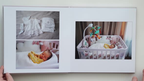 on White Table Photobook From Photo Shoot of Family with Newborn