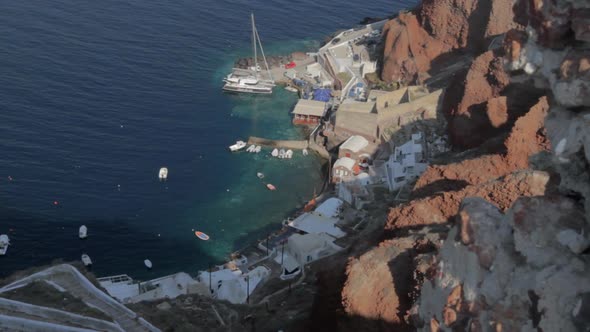 Small fishing and tourist harbor seen from high above. Kamari Santorini.