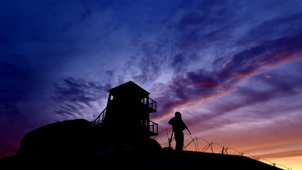 Soldier Watching the Military Watchtower at Evening
