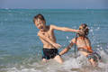 Happy children playing on the beach at the day time. - PhotoDune Item for Sale
