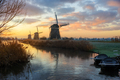 Windmills at sunrise in a rural dutch landscape - PhotoDune Item for Sale