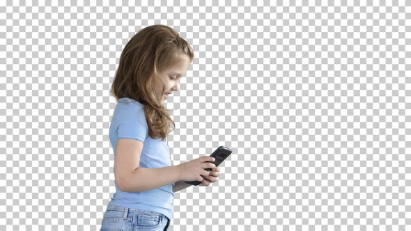 Little girl is playing with smartphone while walking, Alpha Channel