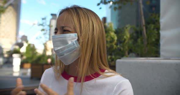 Woman with Mask Doing Refusing Hand Gesture