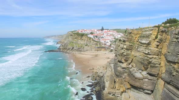 Aerial view of beach and cliffs next to Azenhas do Mar Village.