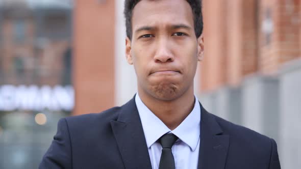 Not Allowed Gesture of Stop By African Businessman Sitting on Bench