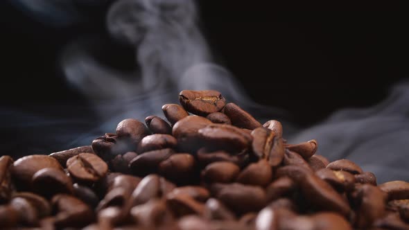 Aromatic Hot Coffee Beans on Black Background