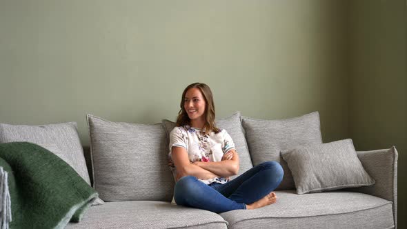 Fresh Woman Sitting on Couch