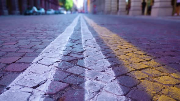 Stone Cobble Carriageway with White and Yellow Stripes