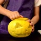 Child Carves a Scary Face in a Pumpkin - VideoHive Item for Sale