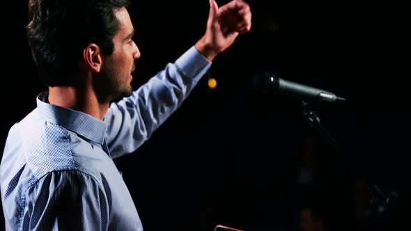 Male business executive giving a speech