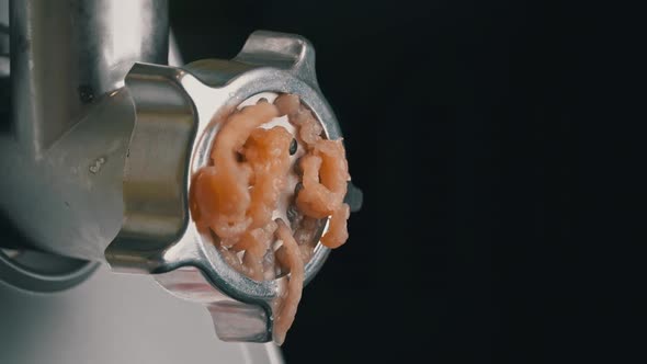 Cooking Minced Meat on an Electric Meat Grinder From Meat Closeup