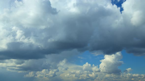 Cloudy Sky With Fluffy Clouds