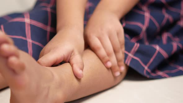 Child Girl Suffering Pain on Feet