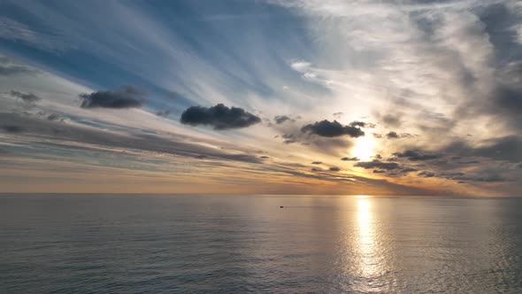 Cloudy sunset at sea aerial view 4 K