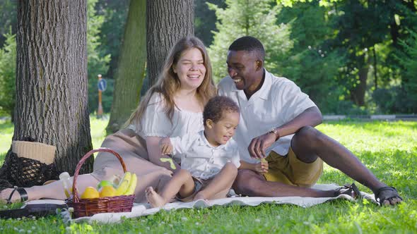 A Cute Multicultural Family Had a Picnic in the Park