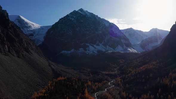 Mount Karatash and Yellow Larches in Aktru Valley in Autumn. Altai, Russia