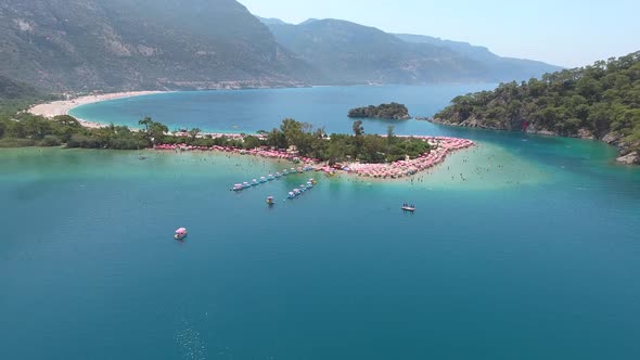 Beach Holiday and Pedalo in the Forested Tourist Sea